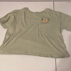sage green “cultivate kindness” butterfly cropped shirt.